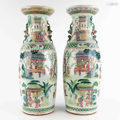 A pair of Chinese Famille Verte vases decorated with workers...