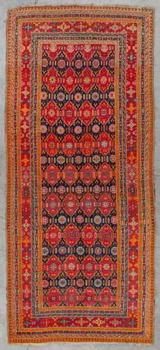 An Oriental hand-made carpet, Karabach (D:290 x W:128 cm)