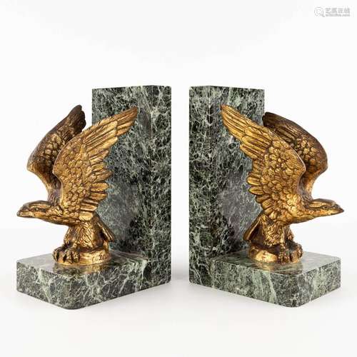 A pair of bookends, bronze and marble. Signed De Laune. Circ...