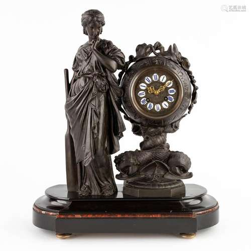 A mantle clock 'Lady with a paddle and zodiac', patinated sp...