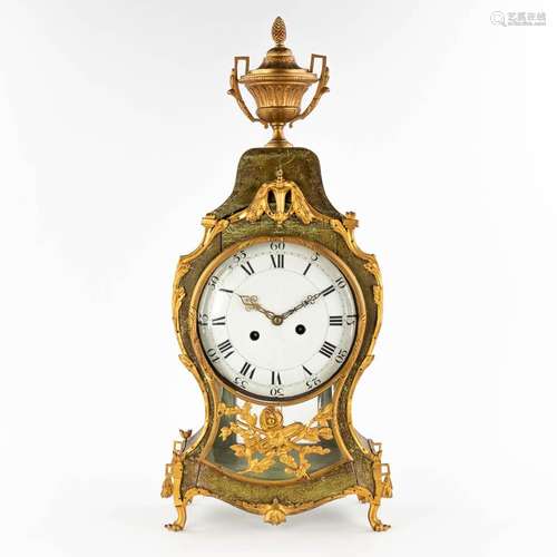 An antique cartel clock, wood mounted with gilt bronze, Loui...