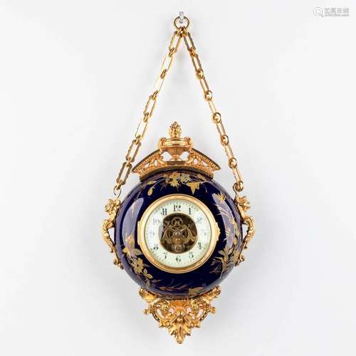 A hanging wall clock, cobalt blue porcelain mounted with bro...