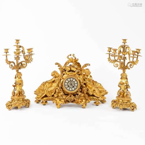 A fine three-piece mantle garniture, gilt bronze, reclined l...