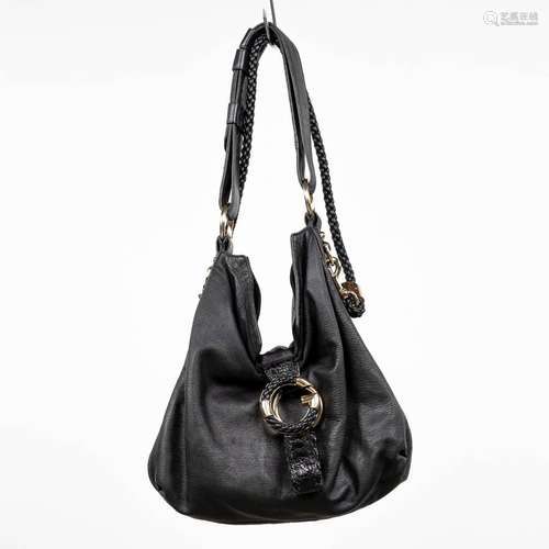 Gucci, a handbag made of black leather, with original belt. ...