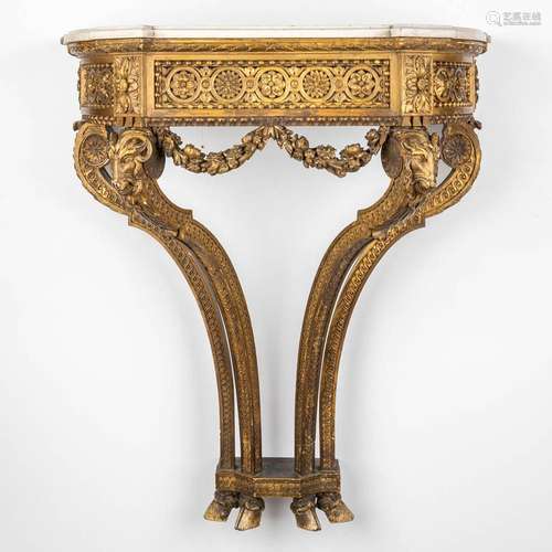 A console table with ram's heads, gilt and sculptured wood a...