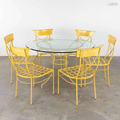 A round table with 6 matching chairs, painted metal. 20th C....