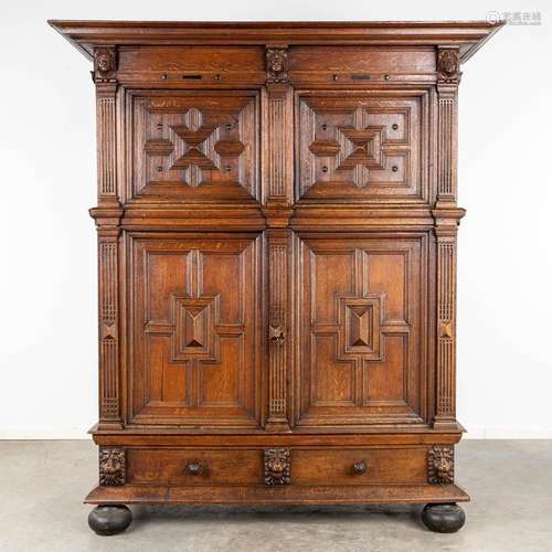 An antique four door cabinet, sculptured oak. 18th C. (D:76 ...