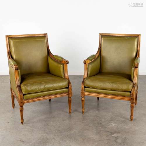 A pair of Louis XVI style armchairs, wood and olive green le...