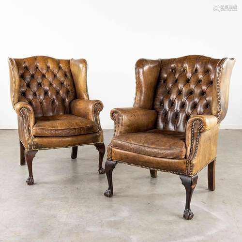 A pair of armchairs, Chesterfield style, leather and wood. (...