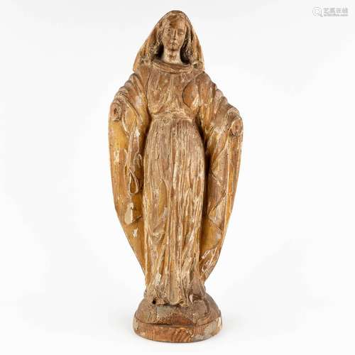 A wood-sculptured Madonna, remains of the original patina. 1...