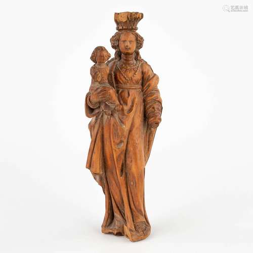 An antique wood sculptured Madonna with Child, 16th C. (D:3,...