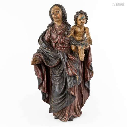 An antique figurine of Madonna with child, polychrome. 17th/...