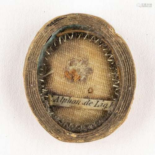 A sealed Theca with a relic and document: Ex Veste Alphonsi ...