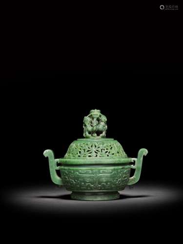 <br />
An archaistic spinach-green jade 'dragon' incense bur...