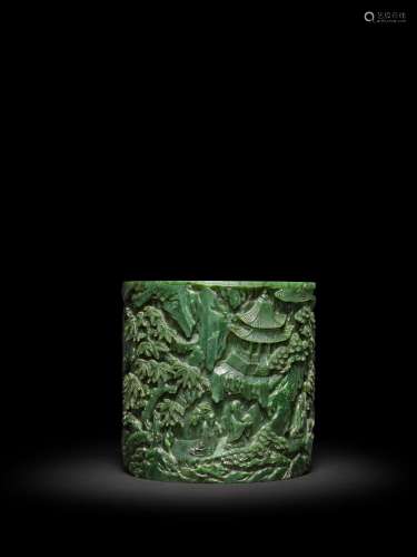 <br />
A spinach-green jade 'landscape' brushpot, Qing dynas...
