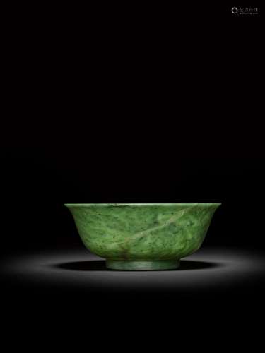 <br />
A large spinach-green jade bowl, Qing dynasty, 18th c...