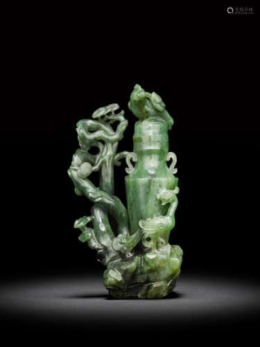 <br />
An archaistic spinach-green jade 'phoenix' vase and c...
