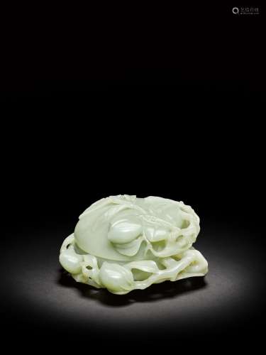 <br />
A large pale celadon jade peach-shaped box and cover,...