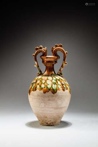 <br />
A superb sancai-glazed 'dragon'-handled amphora, Tang...