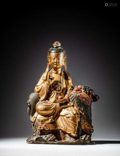 <br />
A gilt and polychrome lacquer bronze figure of a bodh...