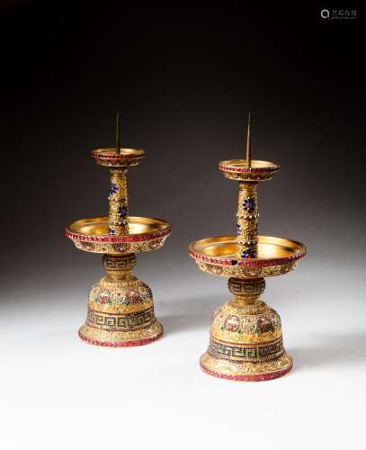 <br />
A pair of gilt-bronze and coloured pastes embellished...