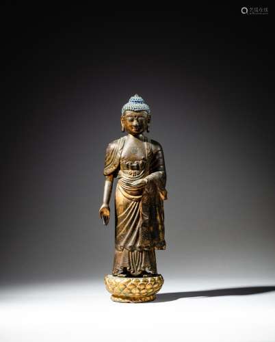 <br />
A gilt-bronze and repoussé figure of Amitabha Buddha,...