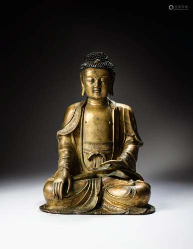 <br />
A rare and important gilt-bronze figure of Shakyamuni...