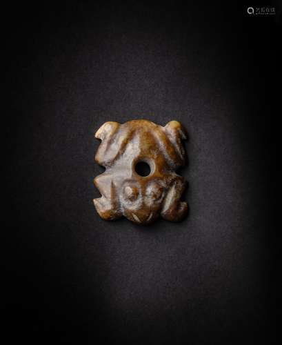 <br />
A brown jade ‘frog’ pendant, Probably Neolithic perio...