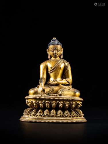 <br />
A finely cast gilt-bronze figure of Shakyamuni Buddha...