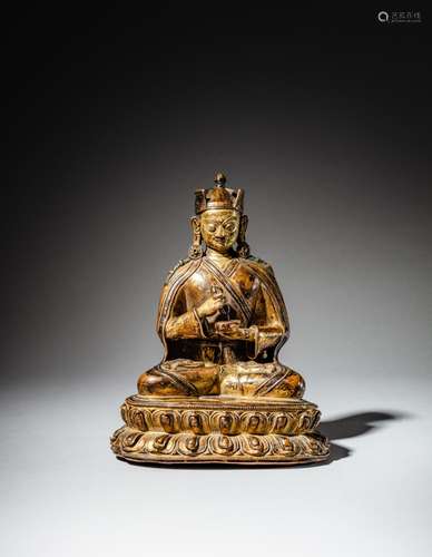 <br />
A gilt-copper alloy figure of Padmasambhava, Tibet, 1...