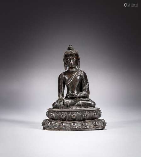 <br />
A silver-inlaid bronze figure of Shakyamuni Buddha, Y...