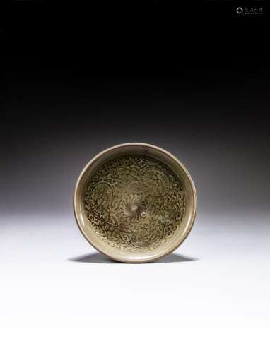 <br />
A moulded 'Yaozhou' celadon ‘chrysanthemum’ bowl, Nor...