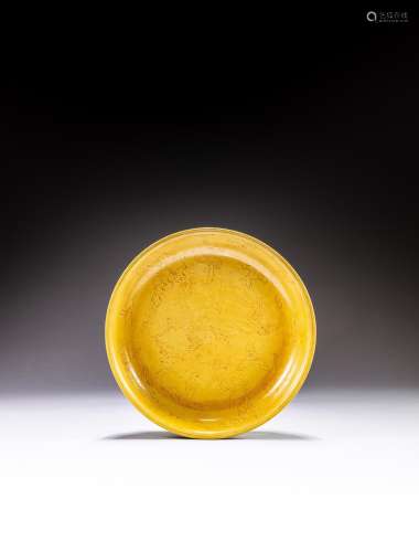 <br />
A large incised yellow-glazed 'phoenix' dish, Early Q...