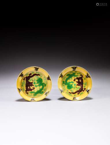 <br />
A pair of yellow-ground aubergine and green-enamelled...