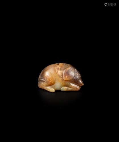 <br />
A small russet and yellow jade figure of a pig, Tang ...