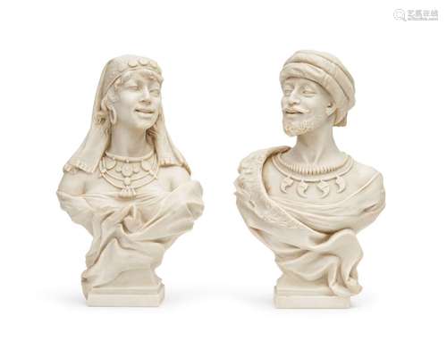 A PAIR OF STONE BUSTS DEPICTING AN ORIENTALIST MAIDEN AND MA...