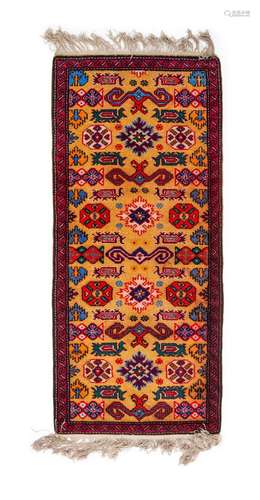 A SMALL RUNNER RUG, PROBABLY RUSSIAN