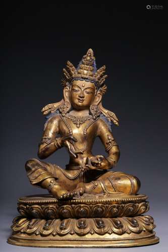 A gilt bronze statue of Vajrasattva with a hammer