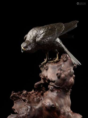 MASATSUNE: A SUPERB AND LARGE BRONZE OKIMONO OF A HAWK ON RO...