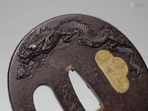 SEIRYUKEN EIJU: A LARGE IRON TSUBA WITH DRAGONS CHASING PEAR...