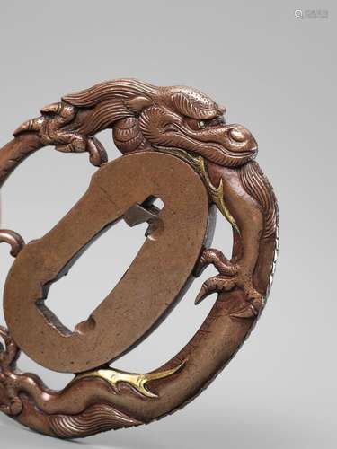 A FINE AND SMALL KOFU SCHOOL TSUBA DEPICTING A DRAGON