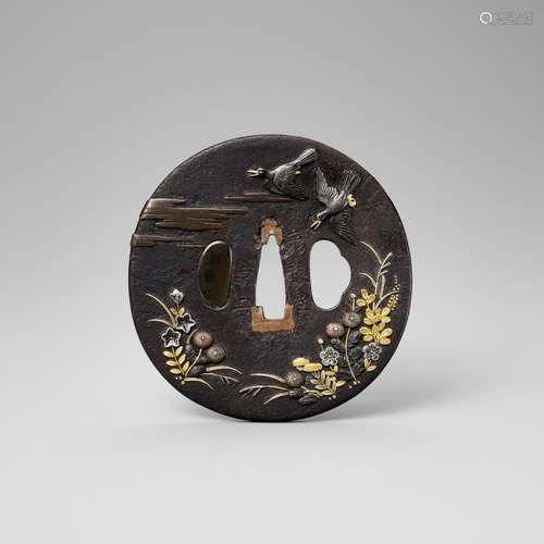 A SOTEN SCHOOL IRON TSUBA WITH BIRDS AND AUTUMN GRASSES