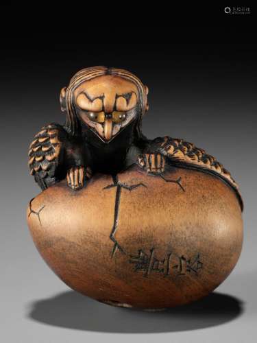 TOYOYO: A WOOD NETSUKE OF A HATCHING TENGU (TENGU NO TOMAGO)