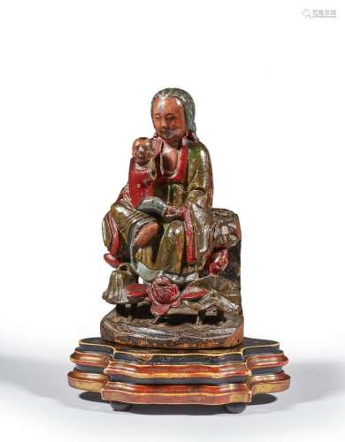 VIETNAM - XIXe siècle
Guanyin en bois laqué, assise en