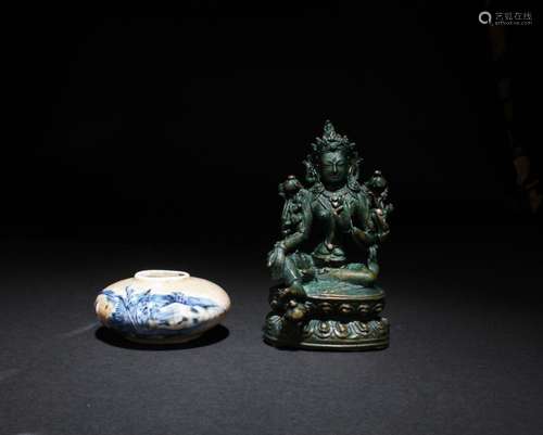 A PORCELAIN WATER DROPPER AND A BRONZE BUDDHA STATUE