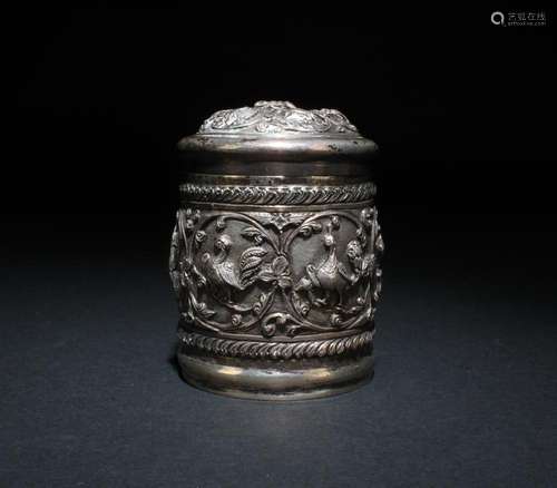 A SILVER JAR WITH LID