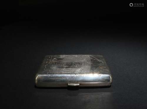 A SILVER CIGARETTE STORAGE CASE