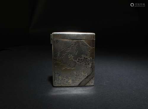 A SILVER CIGARETTE STORAGE CASE