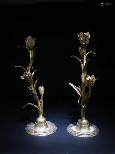 A PAIR OF BRONZE CANDLE HOLDERS