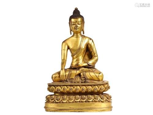 A GILT BRONZE FIGURE OF SHAKYAMUNI